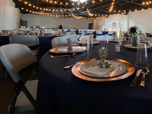 view from table with luxuriously place setting of full Venue 111 event space